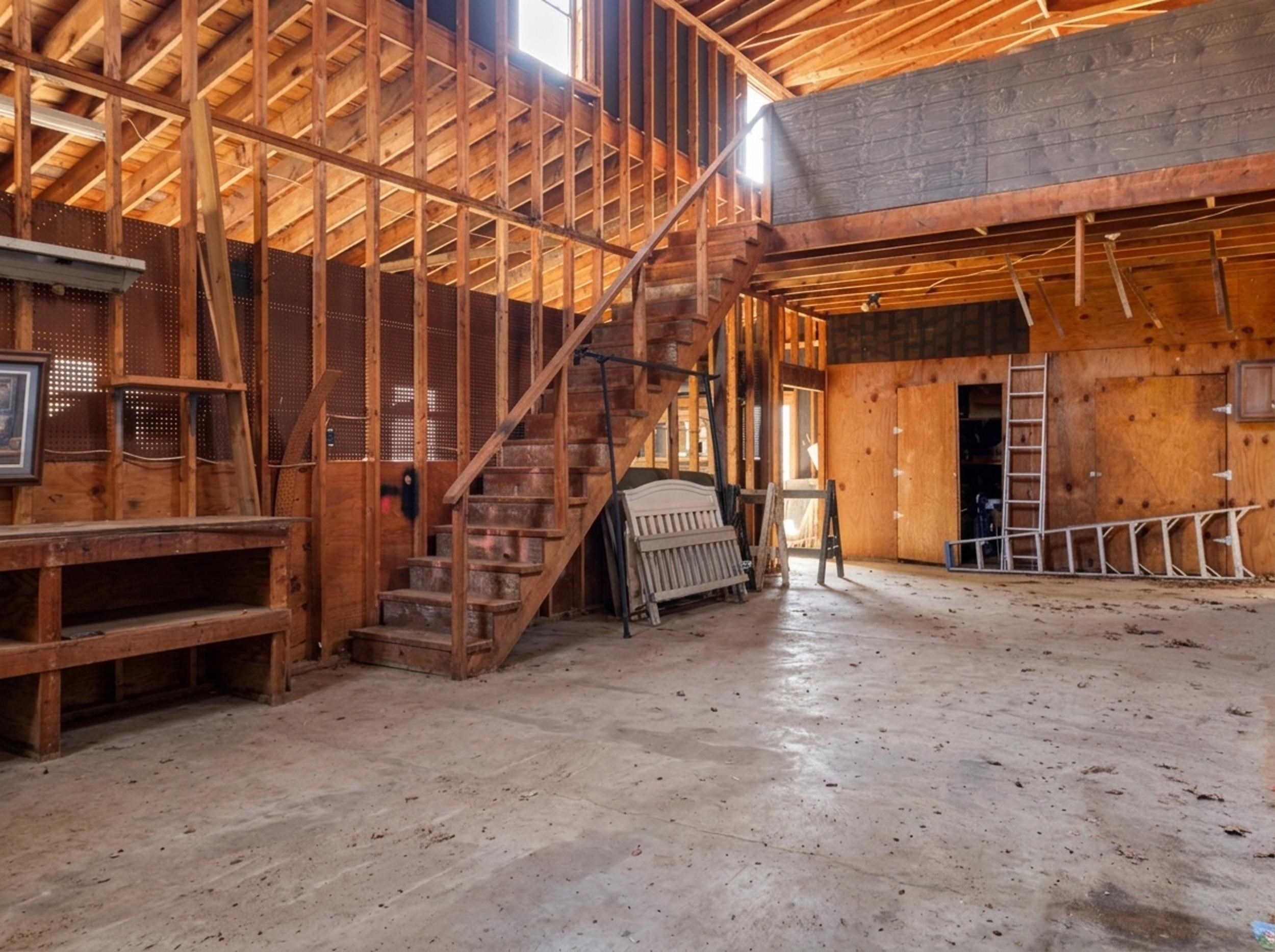 460 Woodbridge Road Somerville, TN 38068 - Photo 39 of 40 BARN featuring a high ceiling and unfinished concrete floors and loft