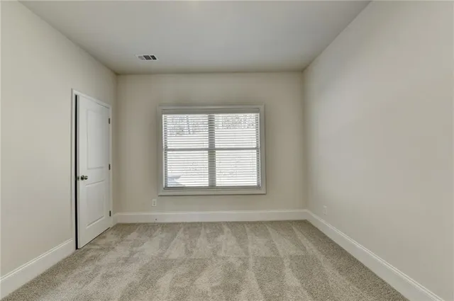 a view of hallway with wooden floor