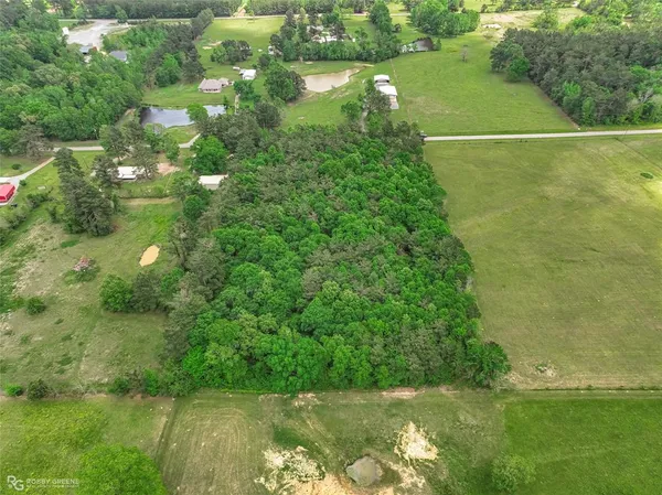 a view of a lake with a yard