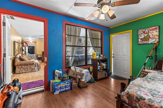 a bedroom with bunk bed and a window