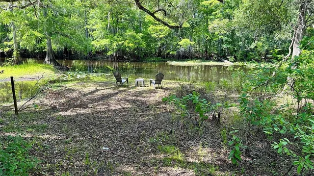a view of a lake with a big yard