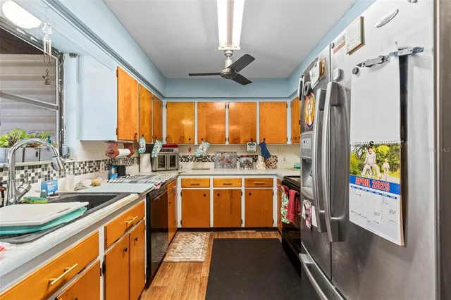 a view of a kitchen with a large window