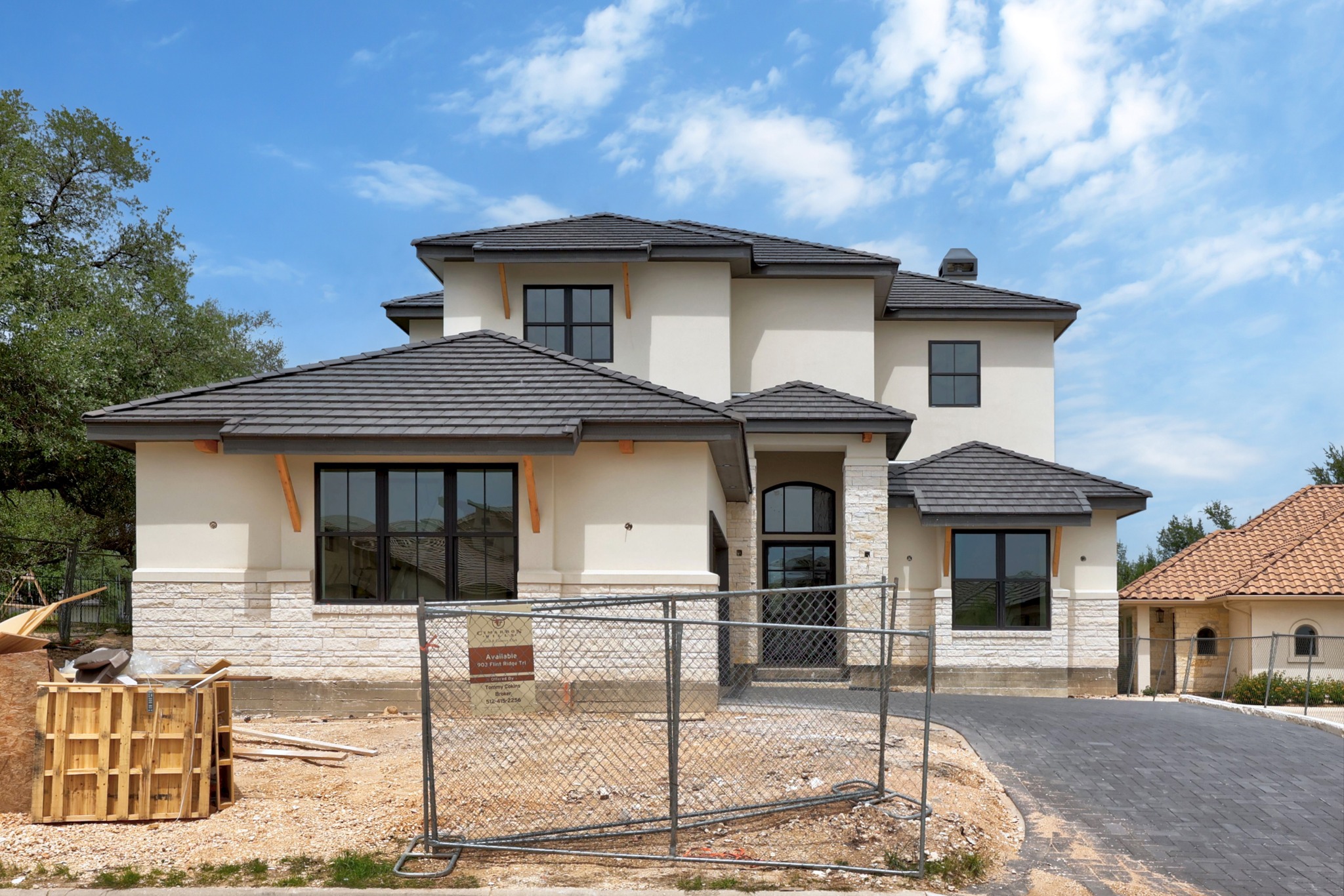 903 Flint Ridge Trail Georgetown, TX 78628 - Photo 39 of 39 Contemporary stucco and stone exterior featuring multiple gables and a dark tile roof