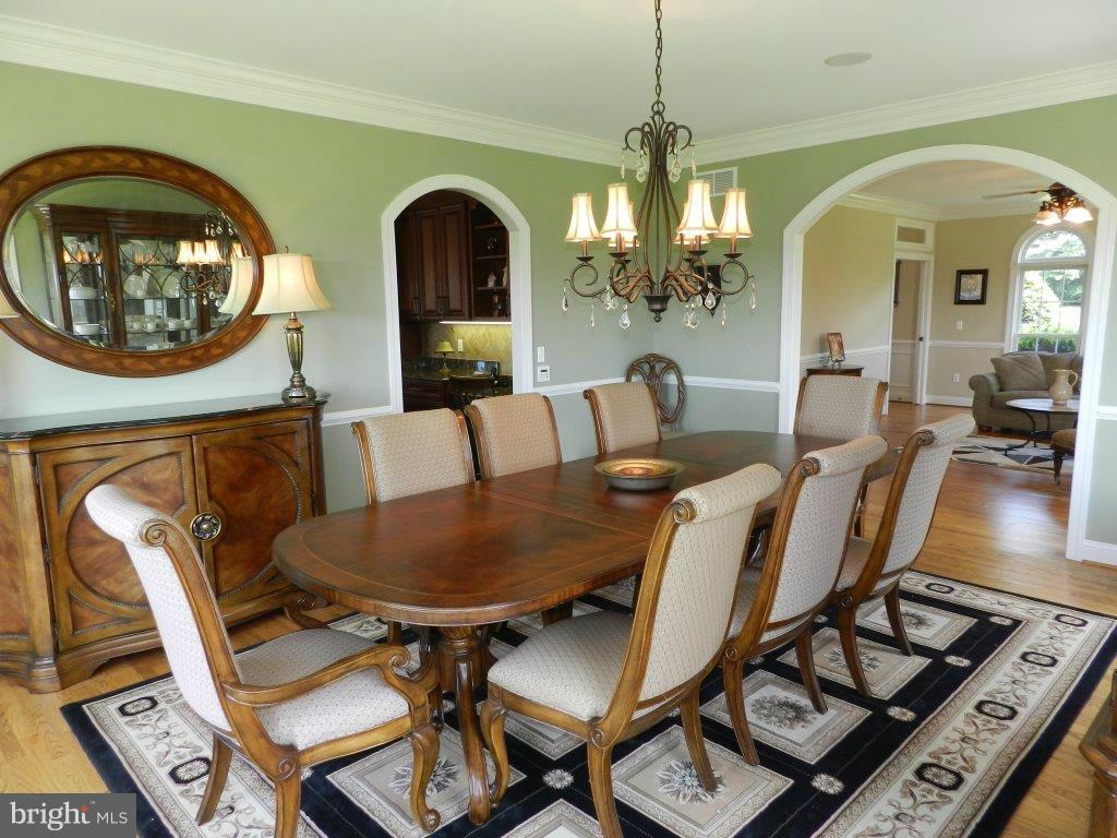 3808 Houcks Road Monkton, MD 21111 - Photo 12 of 30 a view of a dining room with furniture and a chandelier