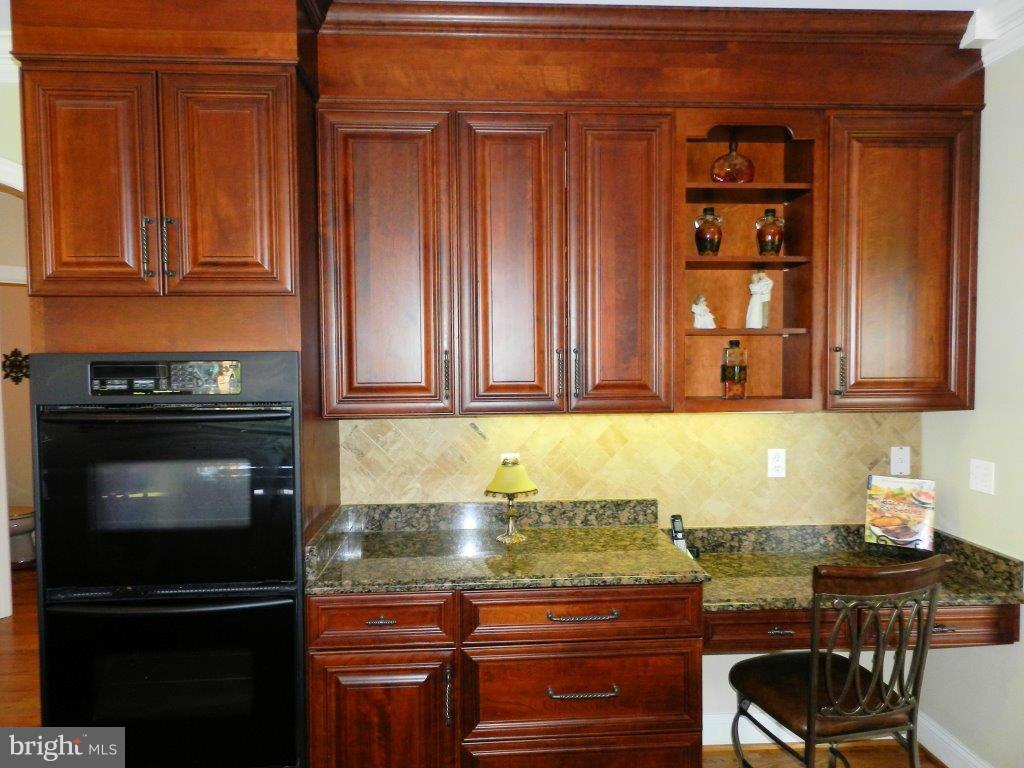 3808 Houcks Road Monkton, MD 21111 - Photo 13 of 30 a kitchen with granite countertop stainless steel appliances and wooden cabinets