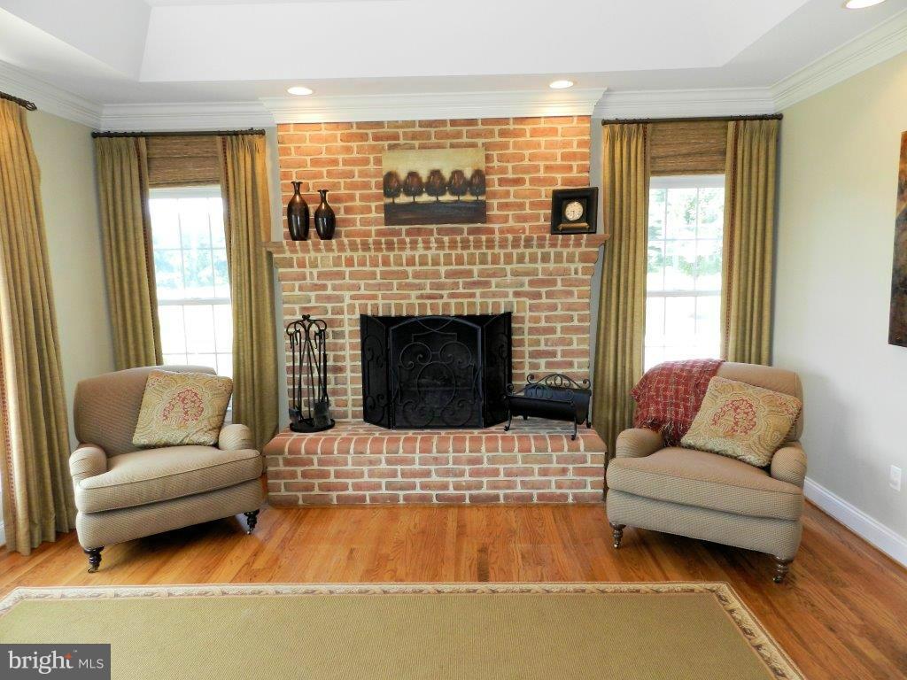 3808 Houcks Road Monkton, MD 21111 - Photo 15 of 30 a living room with furniture and a fireplace
