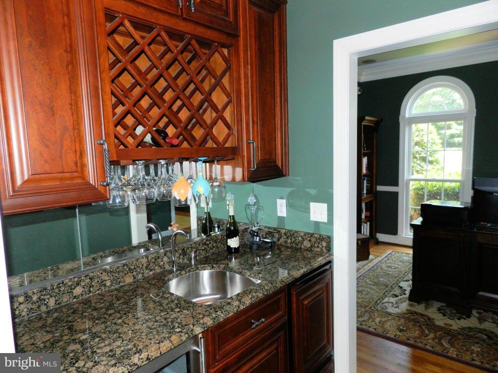 3808 Houcks Road Monkton, MD 21111 - Photo 19 of 30 a kitchen with a granite countertop sink and a stove