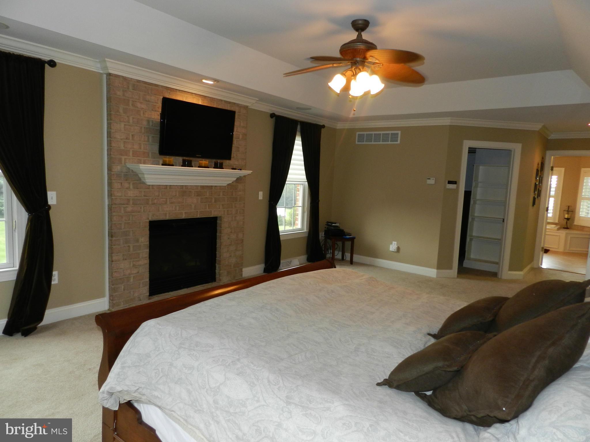 3808 Houcks Road Monkton, MD 21111 - Photo 21 of 30 a bed room with a bed and a television