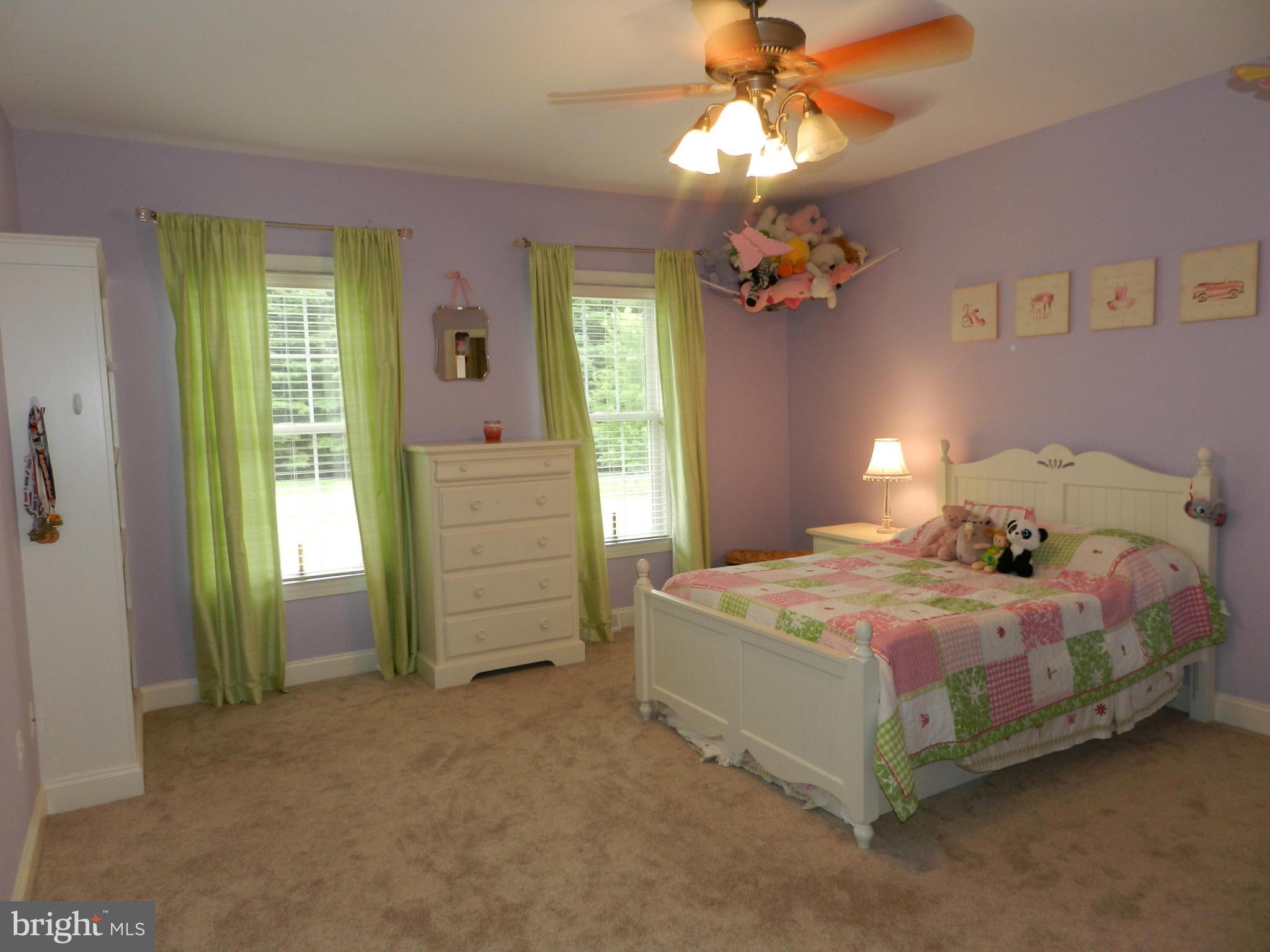 3808 Houcks Road Monkton, MD 21111 - Photo 24 of 30 a bedroom with a bed and a chandelier