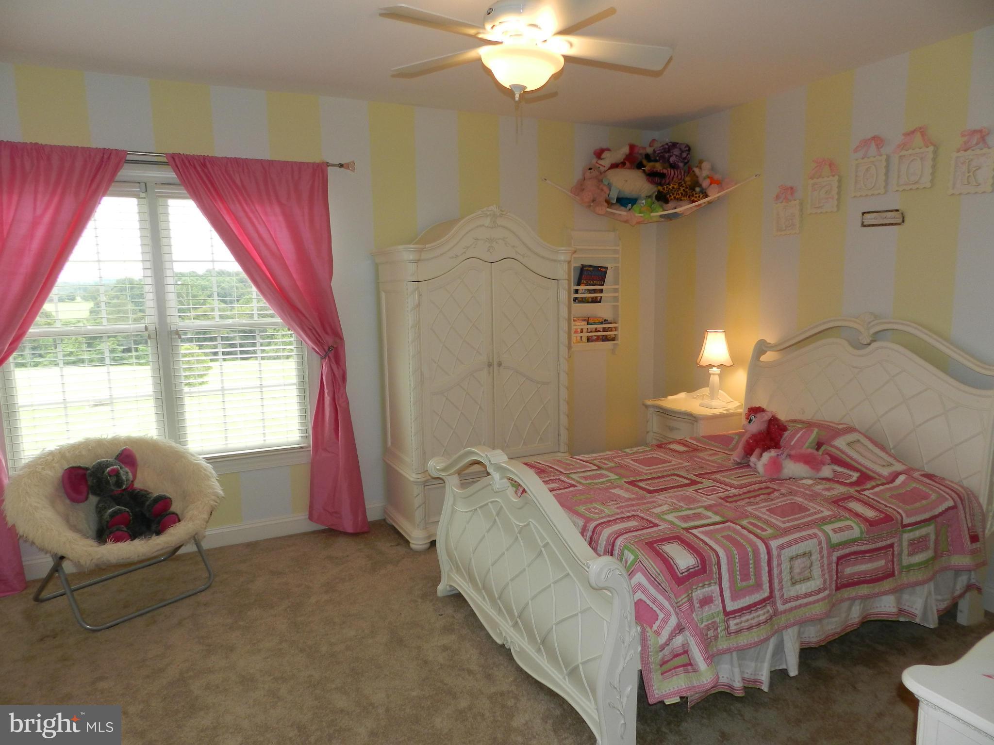 3808 Houcks Road Monkton, MD 21111 - Photo 25 of 30 a bedroom with a bed and a chandelier