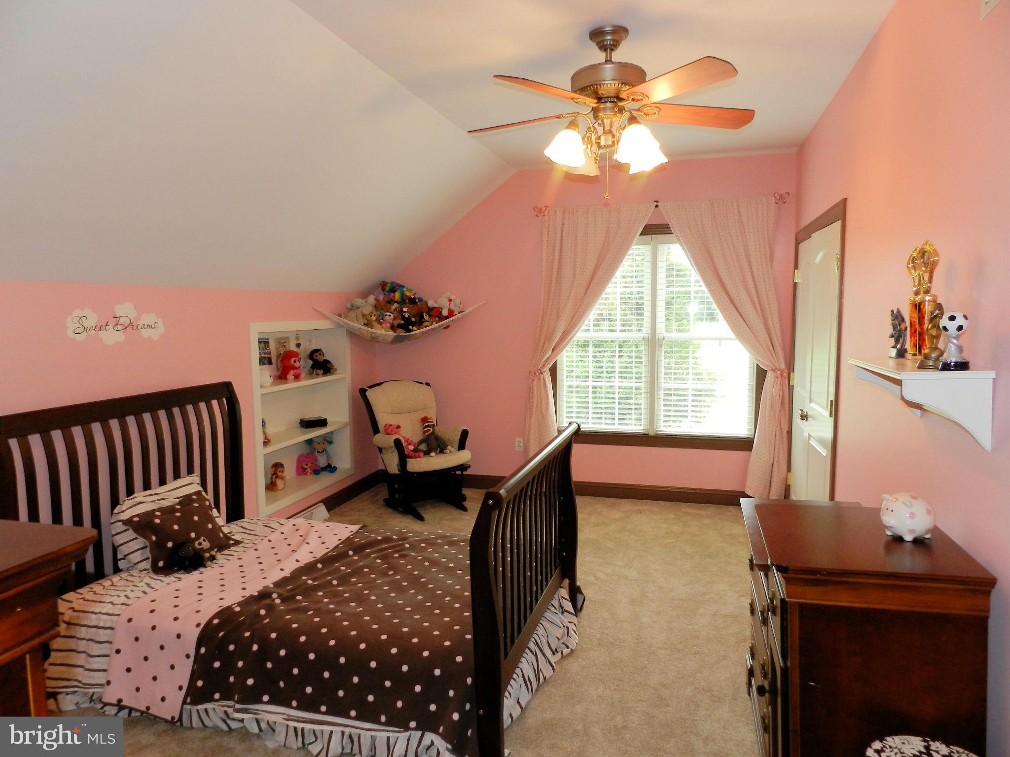 3808 Houcks Road Monkton, MD 21111 - Photo 27 of 30 a bedroom with a bed and a chandelier