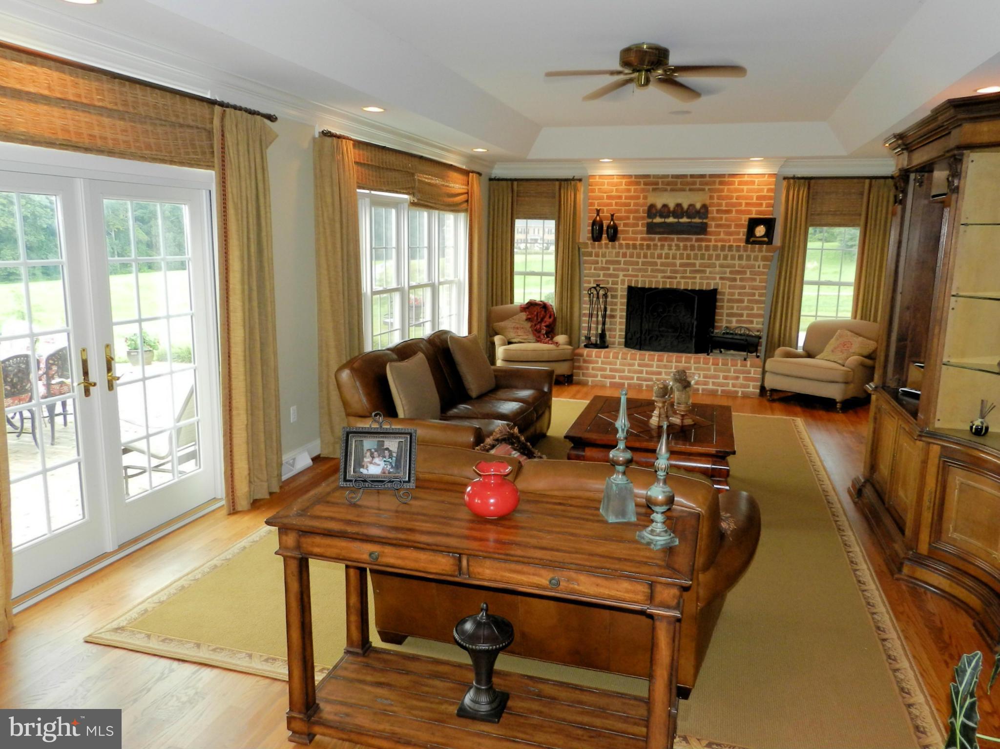 3808 Houcks Road Monkton, MD 21111 - Photo 7 of 30 a living room with furniture a flat screen tv and a fireplace