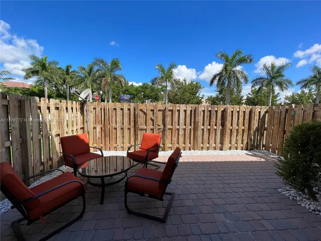 a view of a outdoor sitting area with furniture