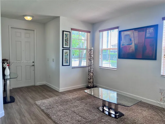 a room with gym equipment and a window