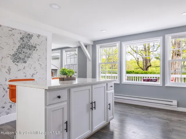 a view of a dining room with furniture and window