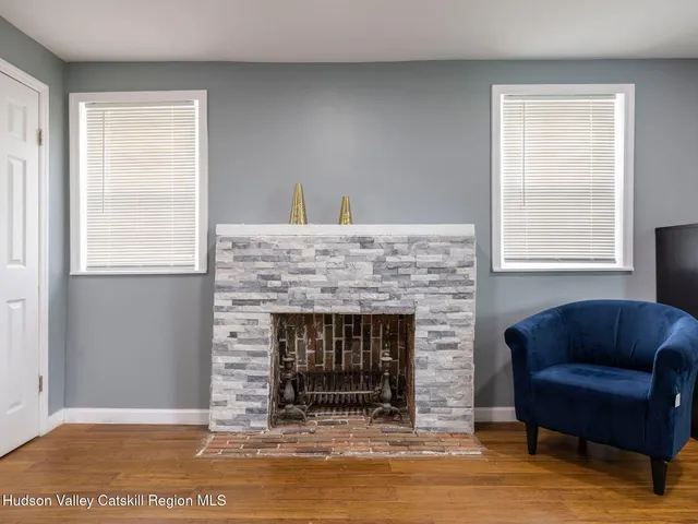 a view of a hallway with wooden shelves