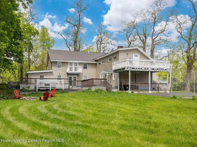 a front view of a house with a yard table and chairs