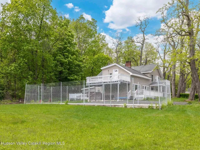 a view of a chairs and table in the balcony