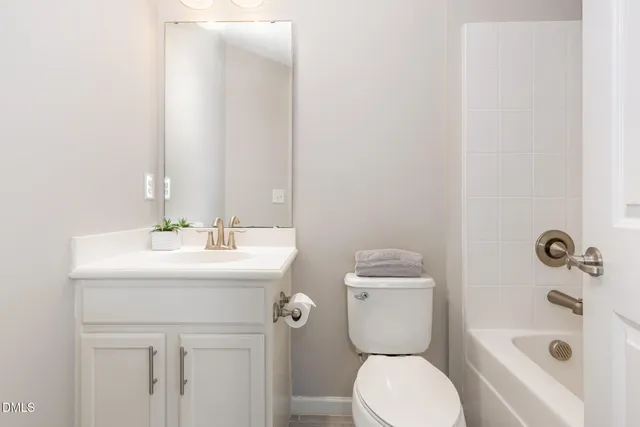 a blue bench sitting in the middle of a yard
