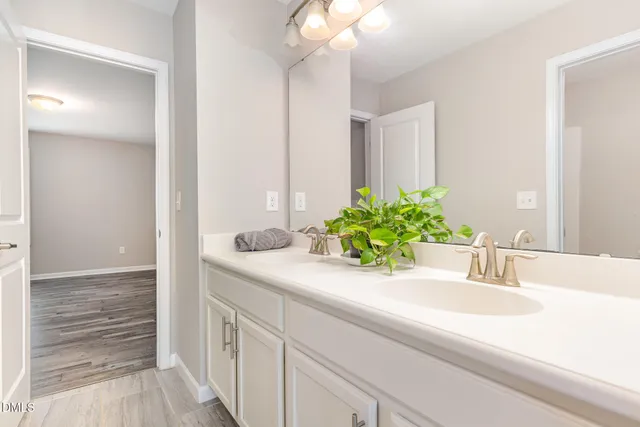 a picture of a bench in front of a building