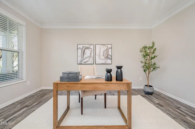 a view of a dining room with furniture and chandelier