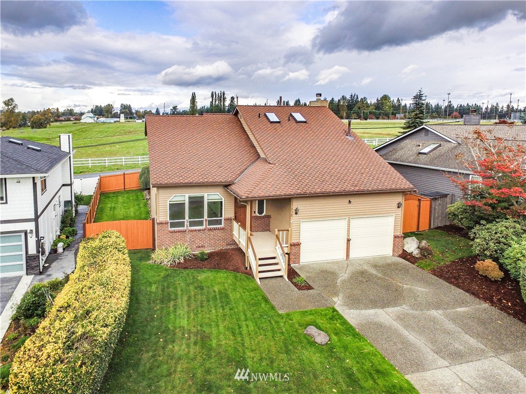 17838 85th Place Northeast Bothell, WA 98011 - Photo 1 of 16 a aerial view of a house with swimming pool and a yard