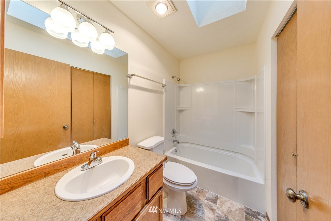 17838 85th Place Northeast Bothell, WA 98011 - Photo 11 of 16 a bathroom with a sink a toilet and shower