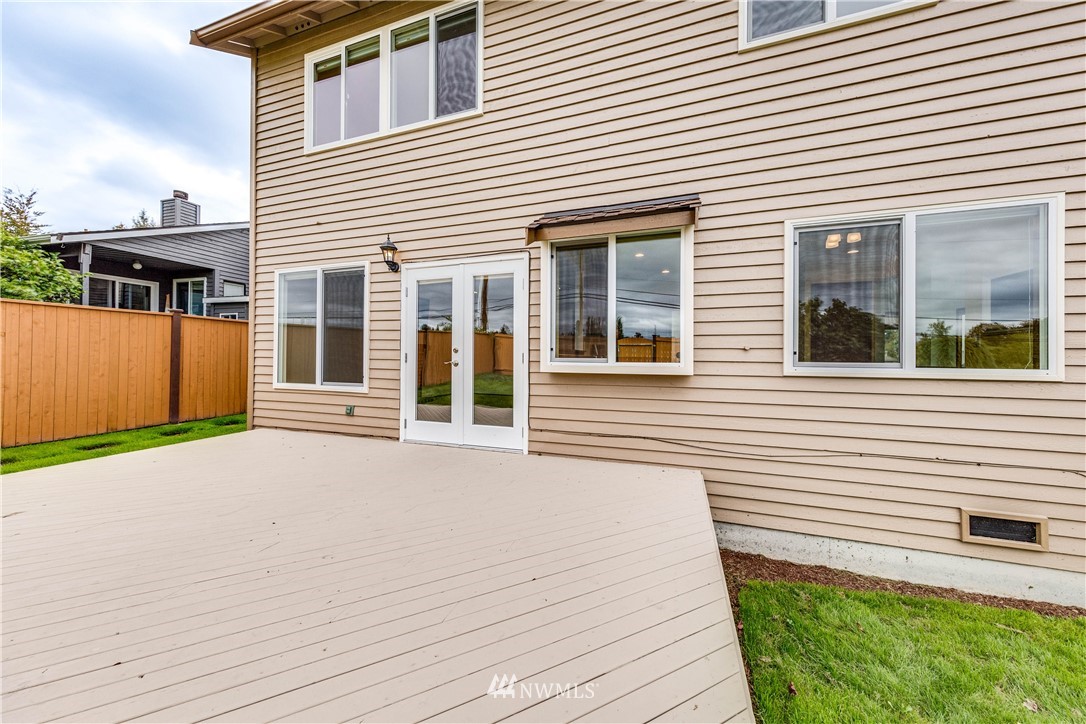 17838 85th Place Northeast Bothell, WA 98011 - Photo 15 of 16 a front view of a house with a yard and garage