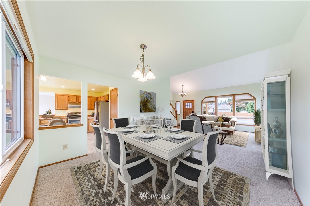 17838 85th Place Northeast Bothell, WA 98011 - Photo 4 of 16 a view of a dining room with furniture wooden floor and a chandelier