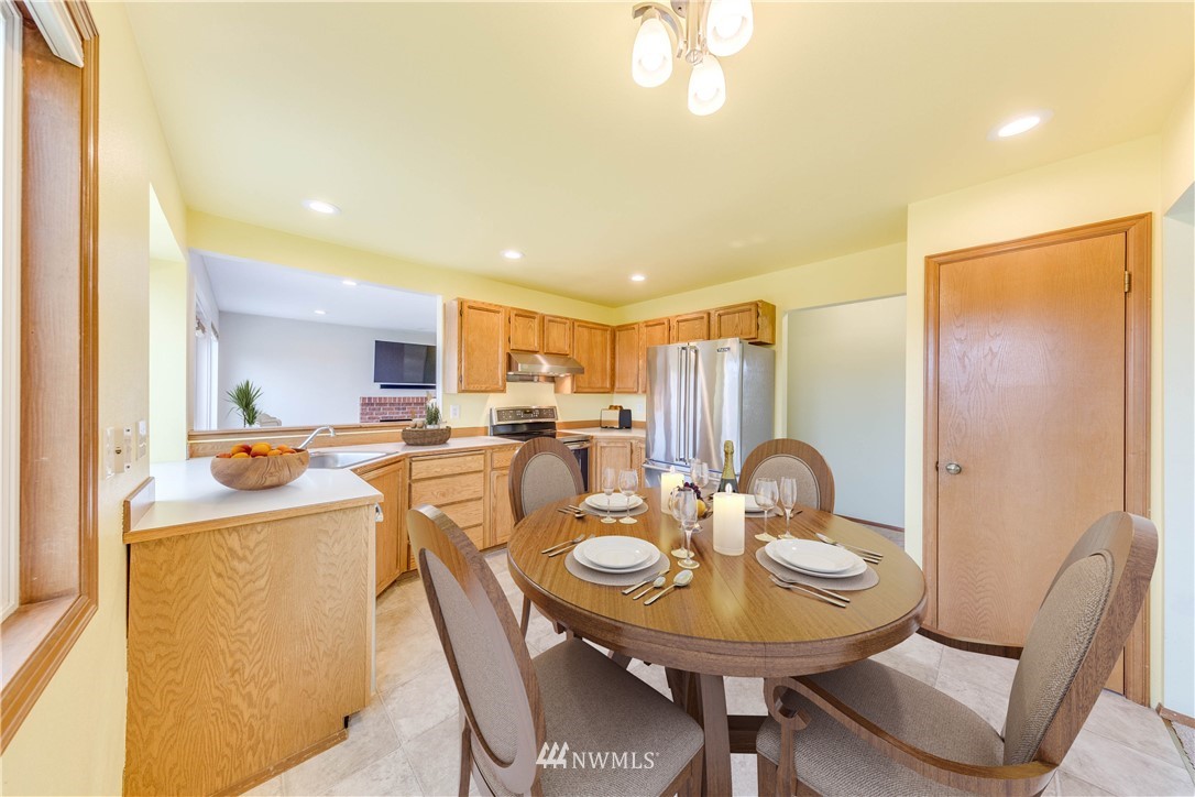 17838 85th Place Northeast Bothell, WA 98011 - Photo 5 of 16 a view of a dining room with furniture and a chandelier