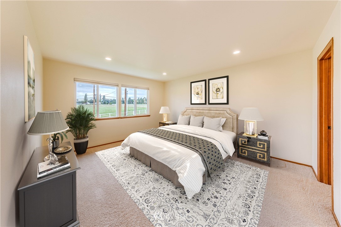 17838 85th Place Northeast Bothell, WA 98011 - Photo 8 of 16 a bedroom with a bed and a dresser with wooden floor
