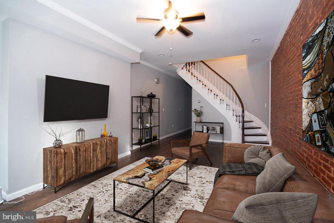 a living room with furniture and a flat screen tv
