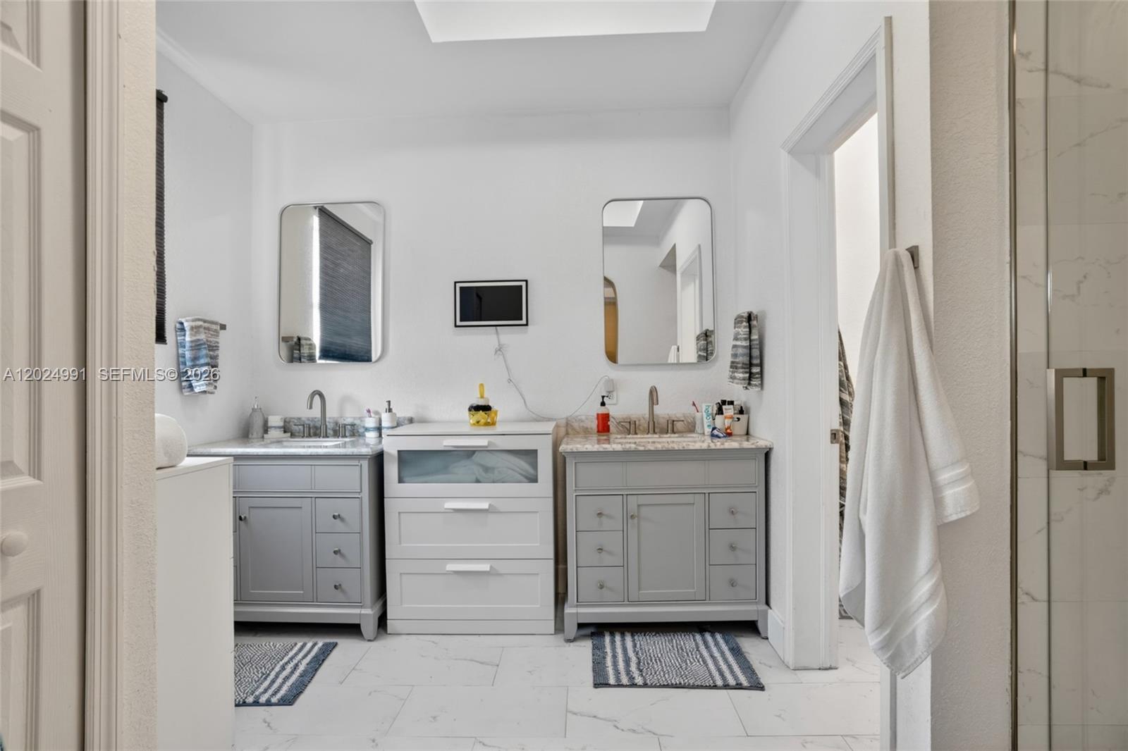 16651 Southwest 79th Terrace Miami, FL 33193 - Photo 13 of 34 a bathroom with a sink vanity and mirror