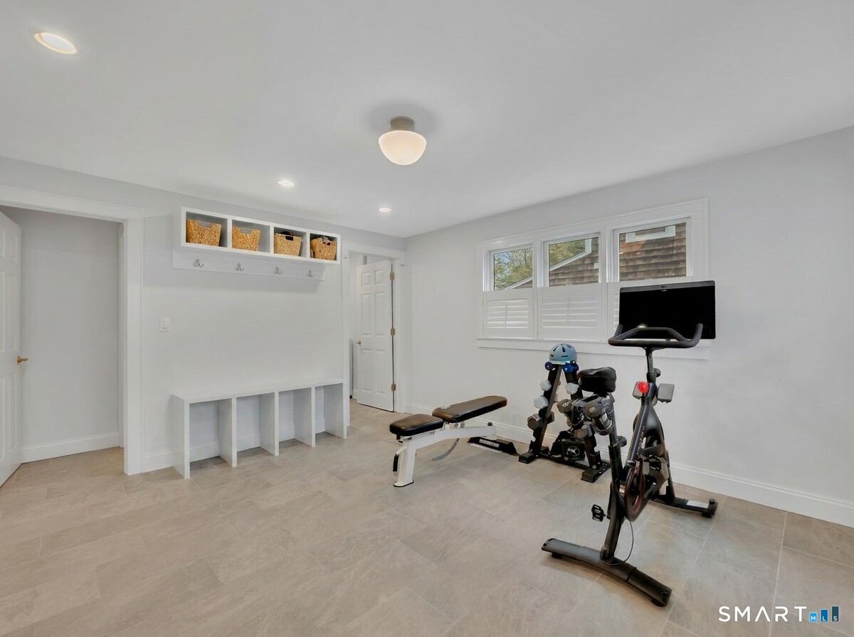 20 Lynnbrook Road Fairfield, CT 06825 - Photo 18 of 40 a view of a room with gym equipment and windows