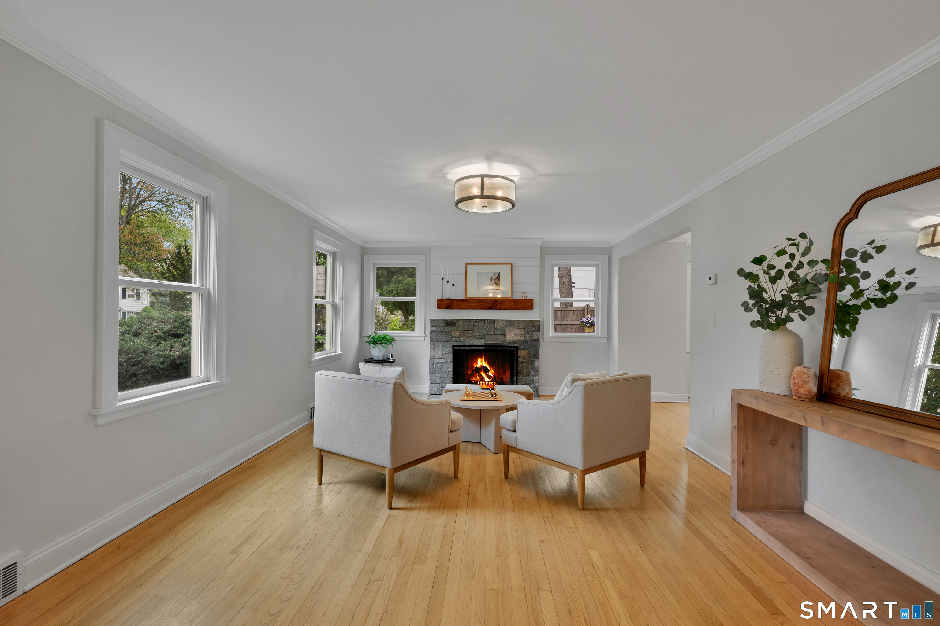 20 Lynnbrook Road Fairfield, CT 06825 - Photo 2 of 40 a living room with furniture and a potted plant