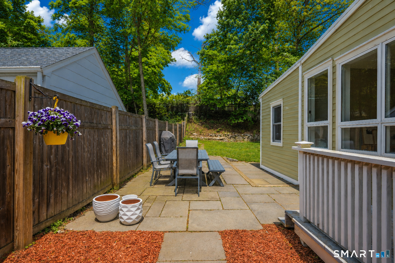 20 Lynnbrook Road Fairfield, CT 06825 - Photo 32 of 40 a view of a patio with two chairs and a table