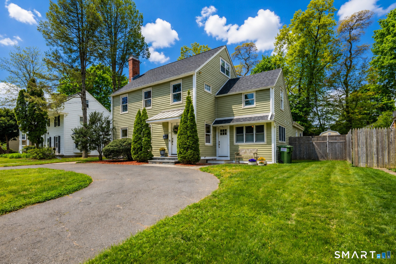 20 Lynnbrook Road Fairfield, CT 06825 - Photo 35 of 40 a front view of a house with a yard and porch