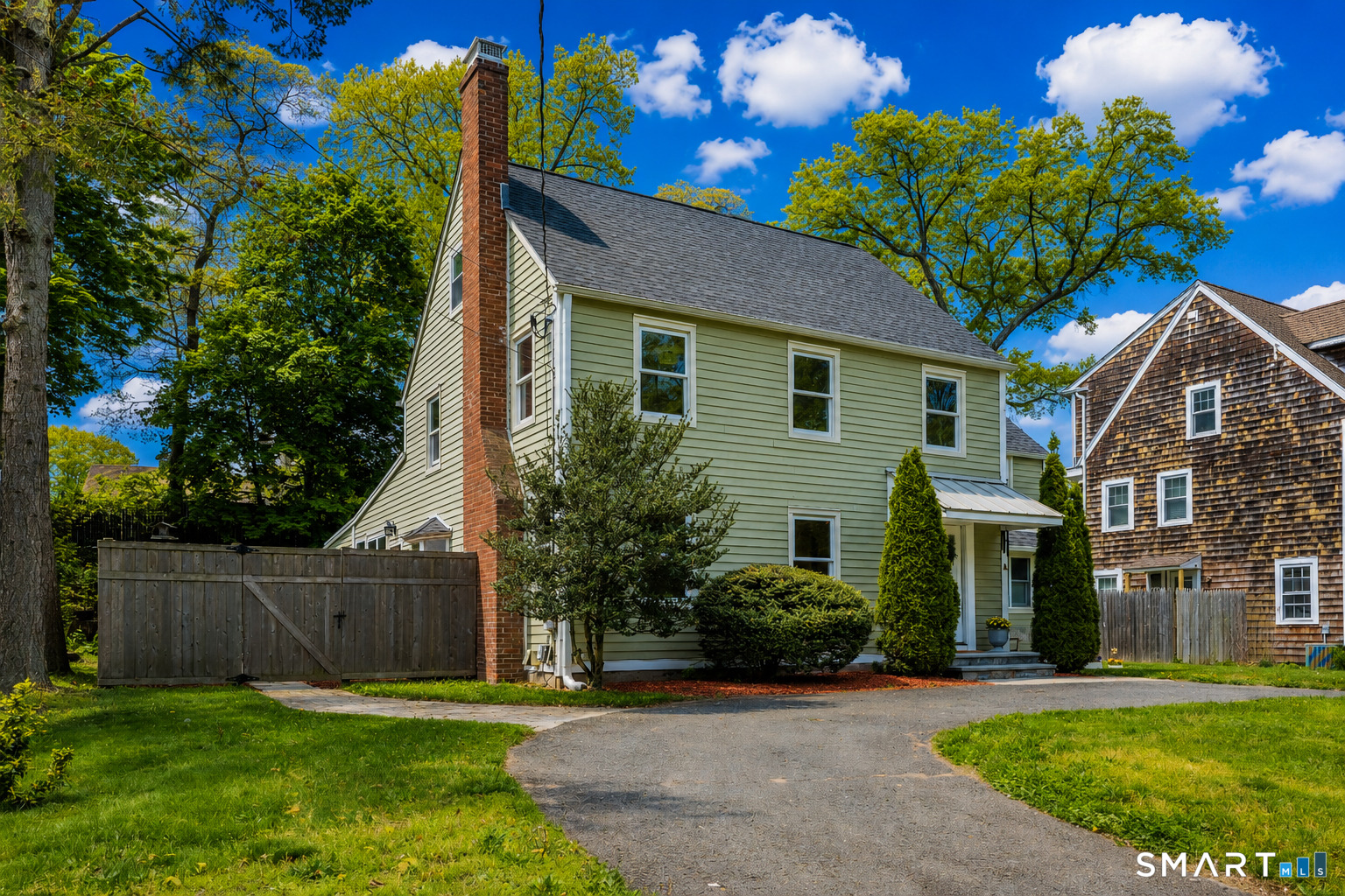 20 Lynnbrook Road Fairfield, CT 06825 - Photo 36 of 40 a front view of a house with a yard