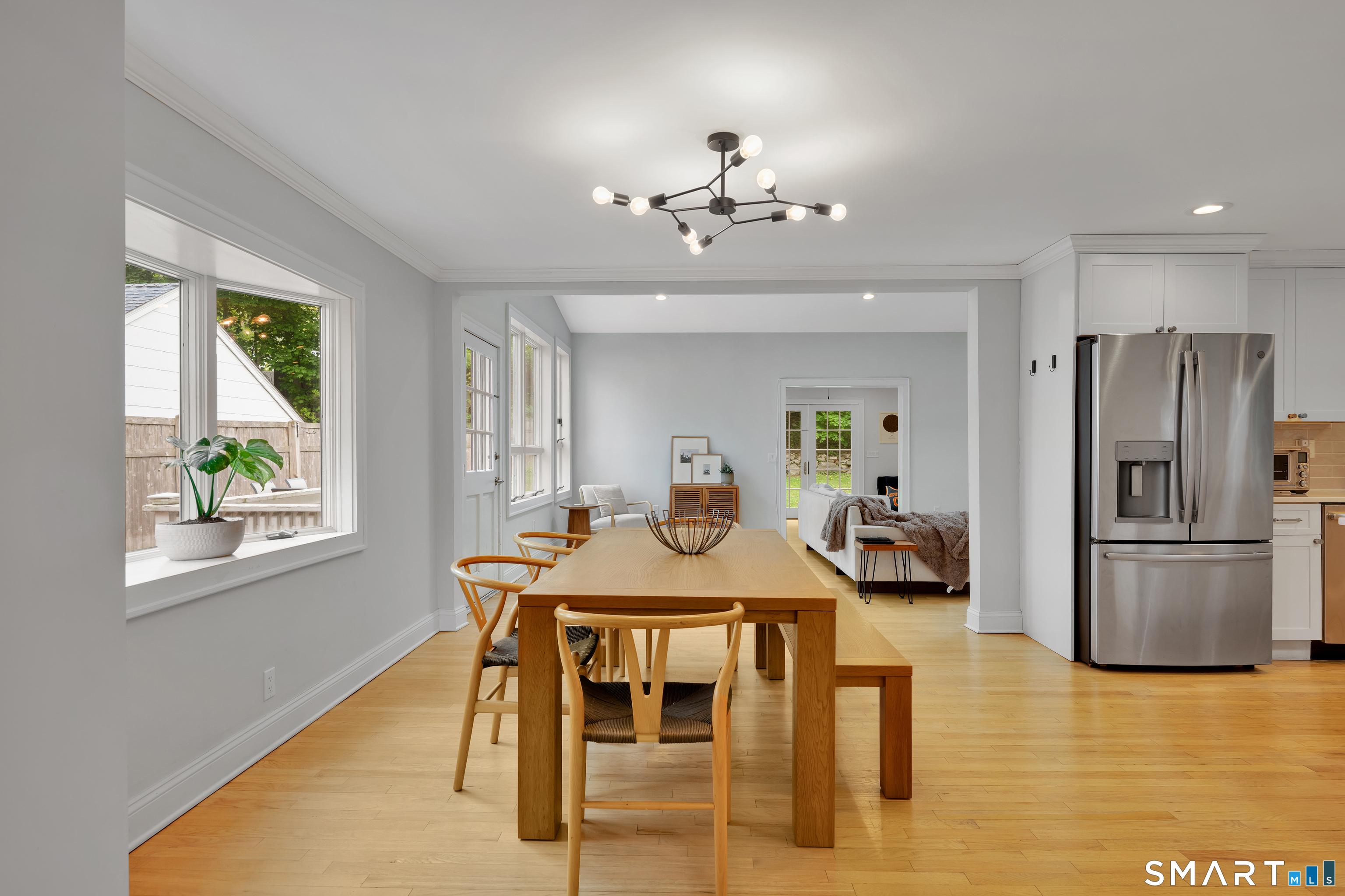 20 Lynnbrook Road Fairfield, CT 06825 - Photo 4 of 40 a view of a dining room with furniture window and wooden floor