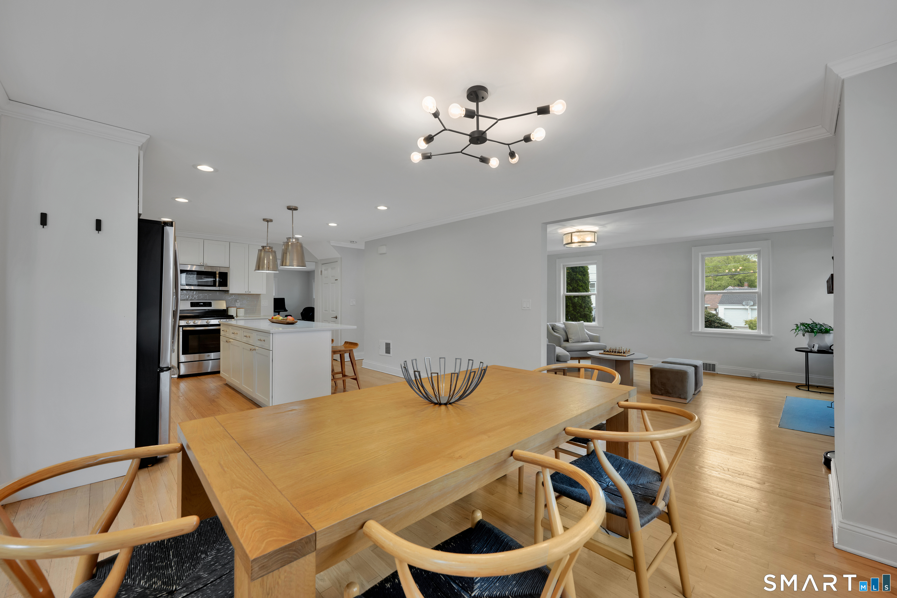 20 Lynnbrook Road Fairfield, CT 06825 - Photo 5 of 40 a view of a dining room with furniture and wooden floor