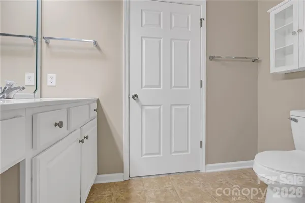 a bathroom with a sink toilet and vanity