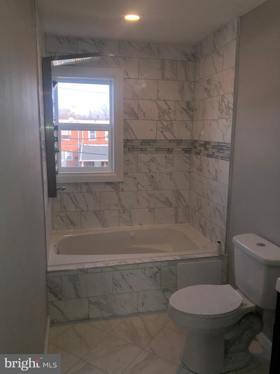 5489 Bucknell Road Baltimore, MD 21206 - Photo 13 of 26 Upper Level Renovated Bath with Gorgeous Tile