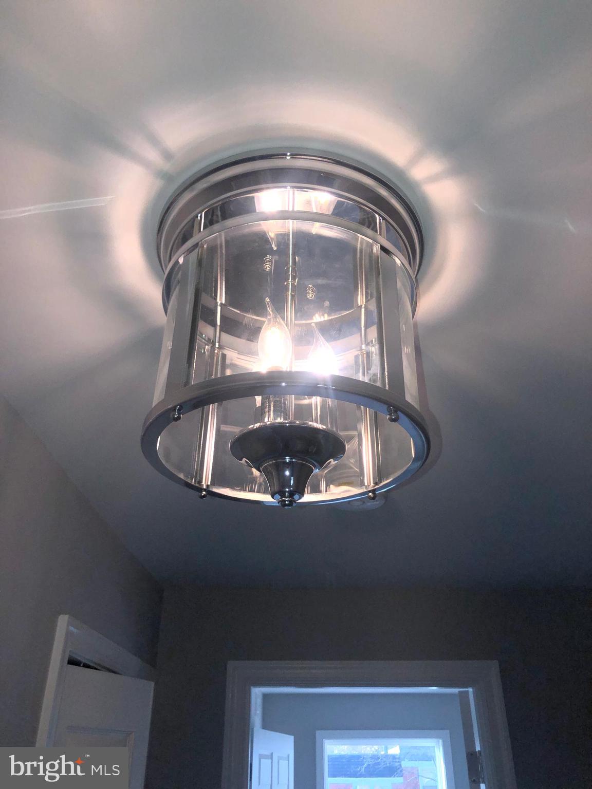 5489 Bucknell Road Baltimore, MD 21206 - Photo 19 of 26 Lighting in Hall Upper Level