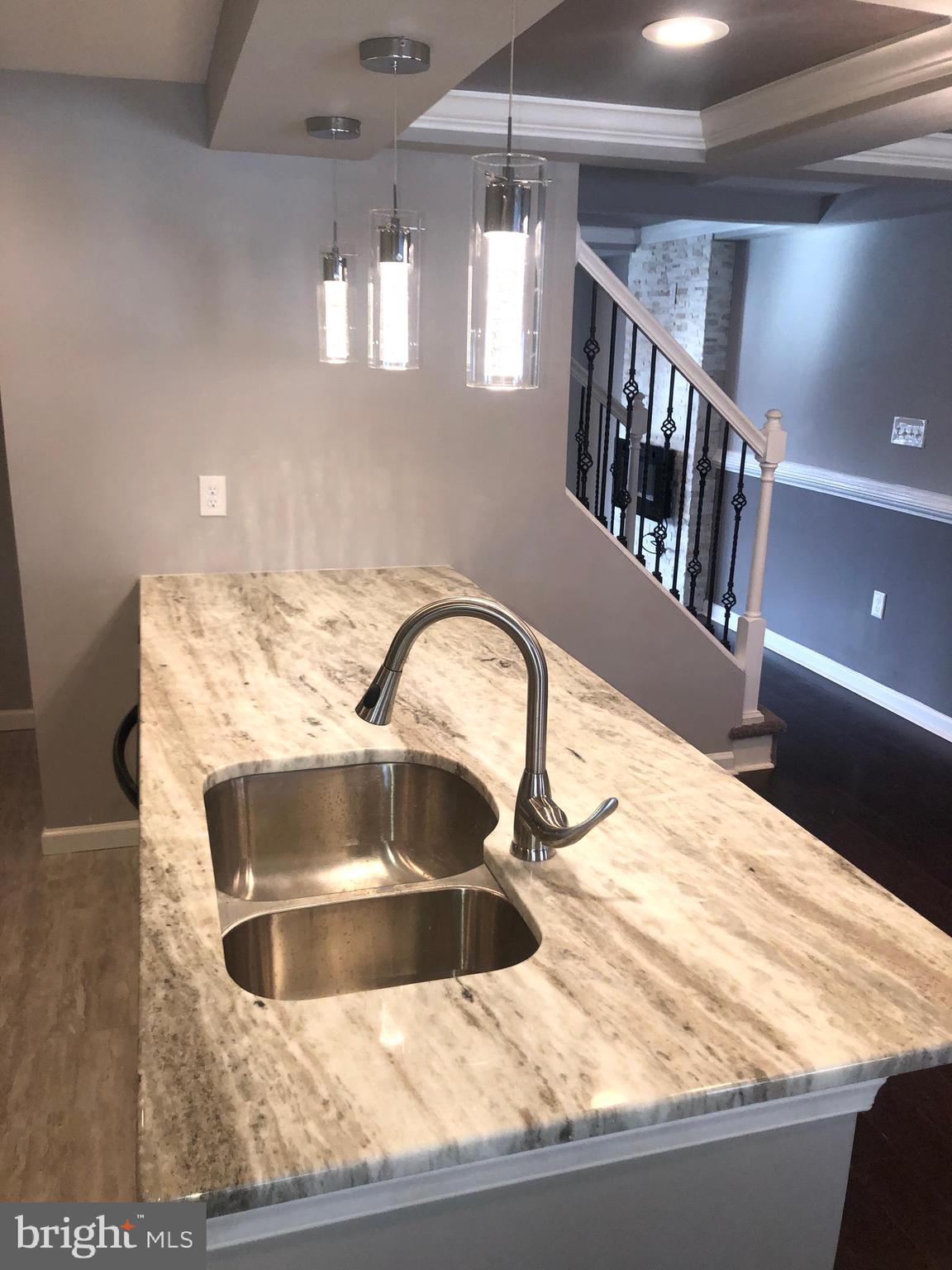 5489 Bucknell Road Baltimore, MD 21206 - Photo 5 of 26 Center Sink with Granite Counters
