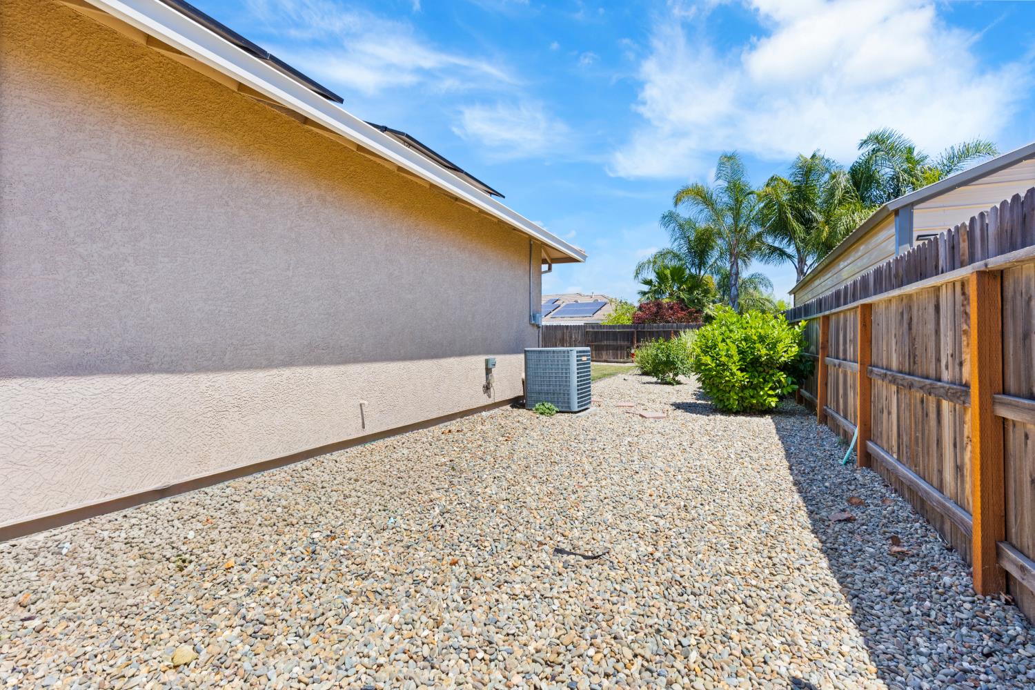 2011 Roy Ranch Way Plumas Lake, CA 95961 - Photo 25 of 49 a backyard with potted plants