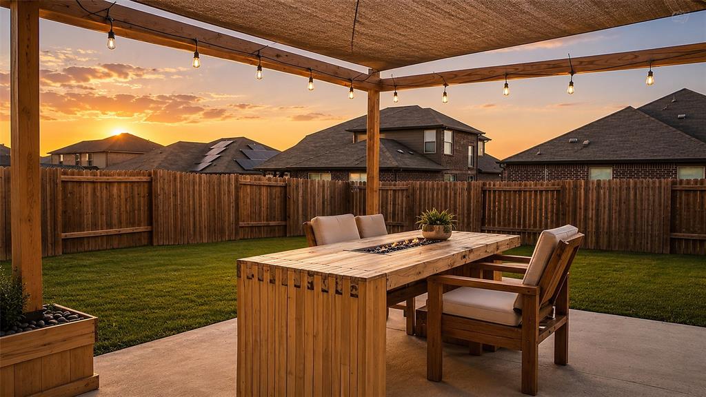 1837 Rialto Lane Crowley, TX 76036 - Photo 24 of 24 Expansive backyard featuring a shaded patio with string lighting, a built-in fire pit table, a manicured lawn, and a wood privacy fence