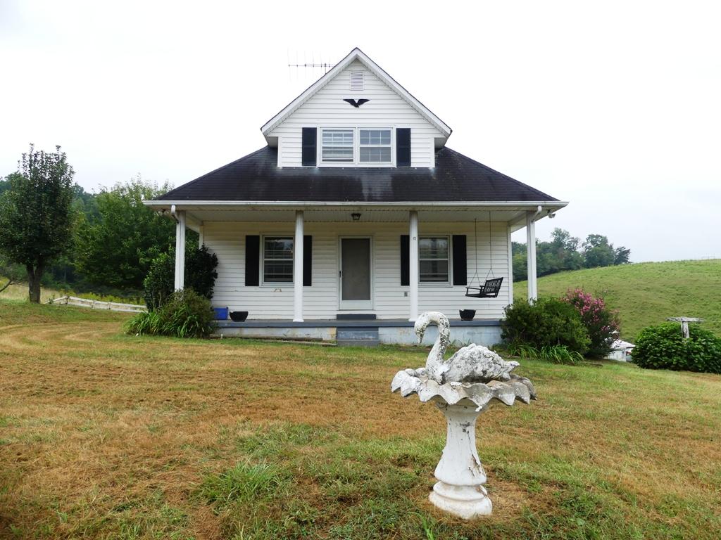 5560 Elamsville Road Stuart, VA 24171 - Photo 1 of 80 a front view of a house with a yard and garage