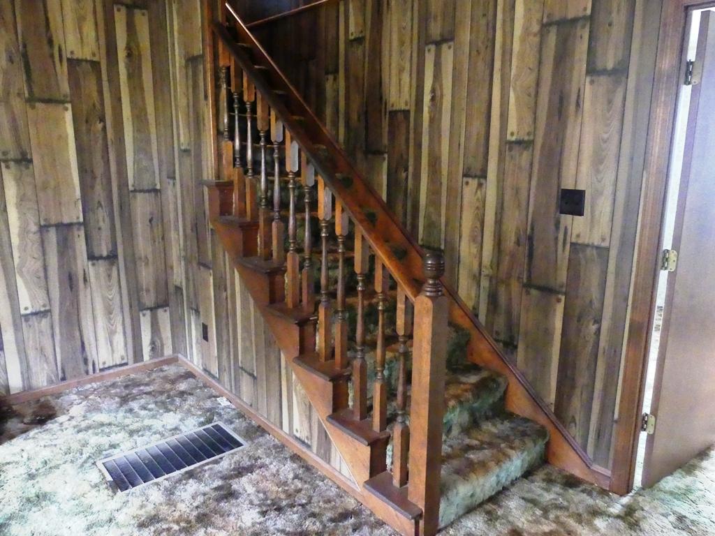 5560 Elamsville Road Stuart, VA 24171 - Photo 23 of 80 a view of staircase with lots of frames on wall