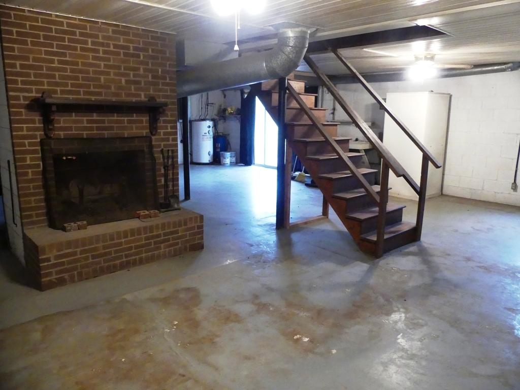 5560 Elamsville Road Stuart, VA 24171 - Photo 37 of 80 a living room with hard wood floors and a fireplace