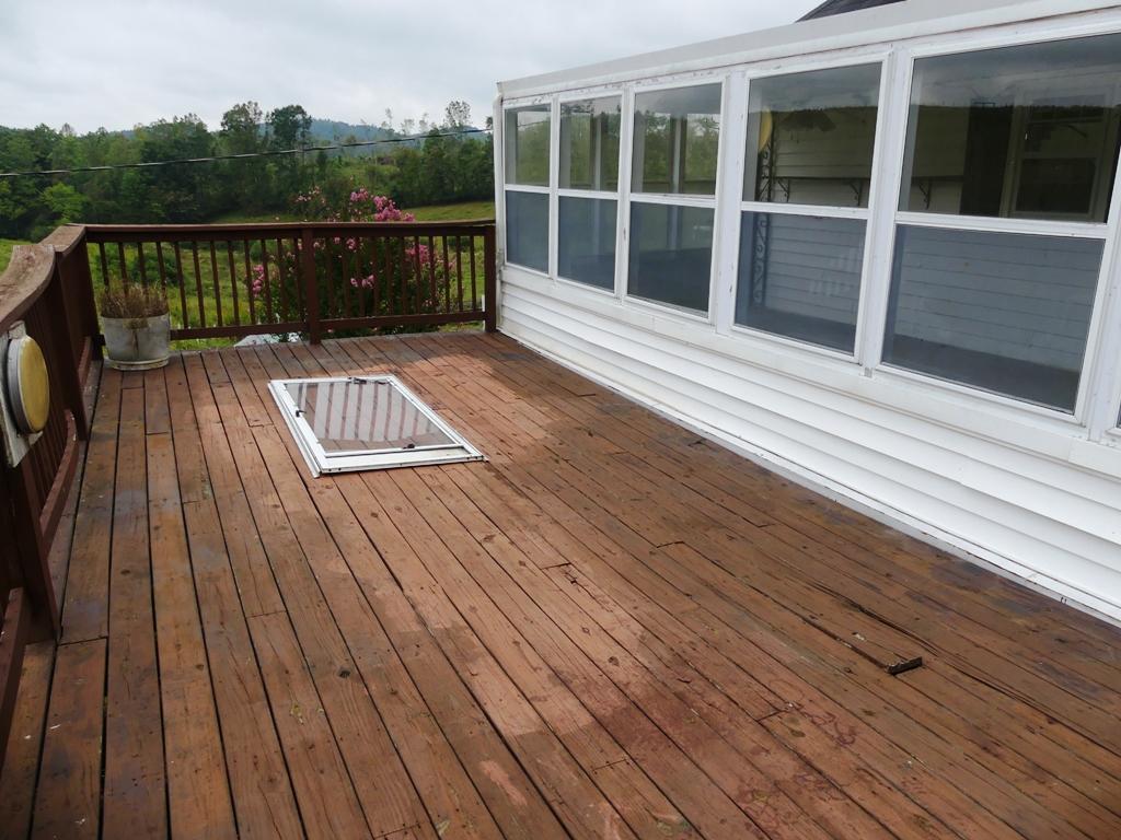 5560 Elamsville Road Stuart, VA 24171 - Photo 39 of 80 a view of deck with wooden floor and outdoor seating